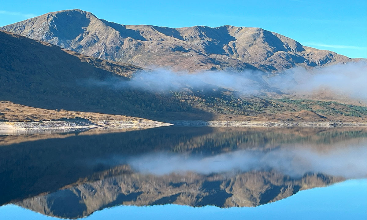 scottish mountains with mirror loch